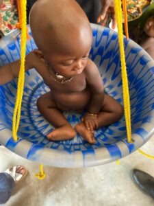 Baby being weighed at Mobile Outreach Clinic