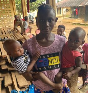 Mother with her children at outreach clinic
