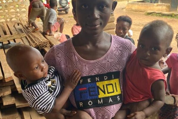 Mother with her children at outreach clinic