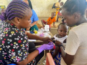 Child being treated at Outreach Clinic